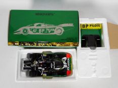 Minichamps - A limited edition highly detailed 1:18 scale Porsche 956L in 'BP' livery as driven by