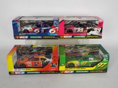 Scalextric - Four boxed Scalextric Nascar 'Ford Taurus' models.