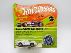 Hot Wheels - Redline - An unopened original carded Ford J-Car in Enamel White.