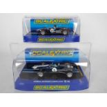 Scalextric - Two boxed Scalextric 'Dan Gurney' slot cars from the Scalextric 'Classic Collection'.