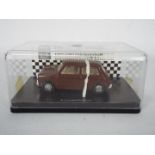 Scalextric - A boxed Limited Edition 1899 MRCC Jersey Morris Mini Minor slot car.