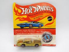 Hot Wheels - Redline - An unopened carded original Custom Continental in Gold.