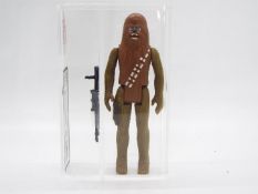 Star Wars - A loose vintage and graded Star Wars 3 3/4 action figure 'Chewbacca'.
