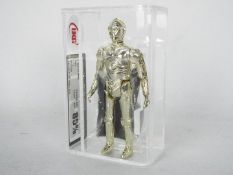 Star Wars - A loose vintage and graded Star Wars 3 3/4 action figure 'C-3PO with Removable Limbs'.