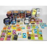 Pokemon - A collection of Pokemon cards and collecting tins.