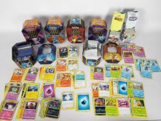 Pokemon - A collection of Pokemon cards and collecting tins.