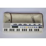 Casio - A vintage Casio VL-Tone VL-5 keyboard with it's original bag.