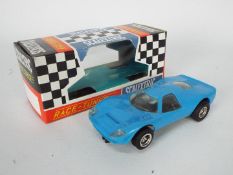 Scalextric - A vintage # C-15 Mirage Ford car in blue with a modern reproduction box.