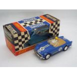 Scalextric - A boxed vintage Triumph TR4A Race Tuned model in blue # C-84.