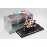Scalextric - A boxed 2004 Moto GP Repsol Honda ridden by Nicky Hayden # C6016 The model appears