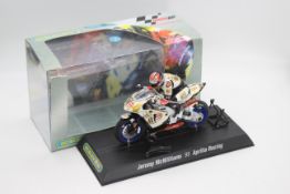 Scalextric - A boxed 2004 Moto GP Aprillia ridden by Jeremy McWilliams # C6011 The model appears
