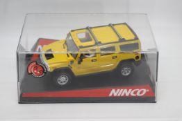 Ninco - A boxed Hummer H2 slot car in yellow # 50457.