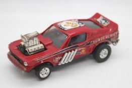 Scalextric - A very rare Mexican made Ford Mustang Dragster in red # 4049 The model shows signs of