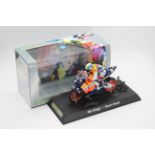 Scalextric - A boxed 2004 Moto GP Repsol Honda ridden by Max Biaggi # C6022 The model appears Mint