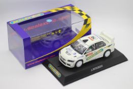 Scalextric - A boxed Mitsubishi Lancer Evo 7 WRC Collectors Club 5005 edition # C2682.