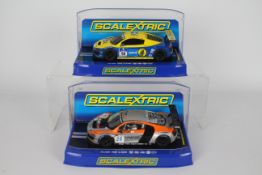 Scalextric - Two boxed Scalextric Audi R8 LMS 1:32 scale slot cars.