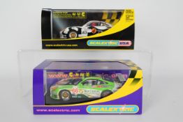 Scalextric - Two boxed Scalextric Porsche 911 GTR3 1:32 scale slot cars.