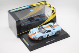Scalextric - a boxed 1968 Ford GT40 number 9 car in Gulf colours # C2403.