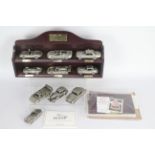 Danbury Mint - A boxed collection of 10 Danbury Mint Jaguar 1:43 scale pewter cars with wooden