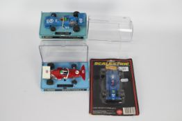 Scalextric - 3 x boxed / carded race car models, a March Ford 721 # C026,