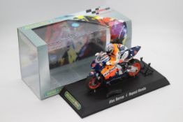 Scalextric - A boxed 2004 Moto GP Repsol Honda ridden by Alex Barros # C6004 The model appears Mint