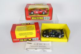 Scalextric - SCX - 2 x boxed Ferrari F40 models, a black car # 83450G.