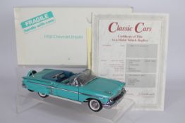 Danbury Mint - A boxed Danbury Mint 1:24 scale 1958 Chevrolet Impala.