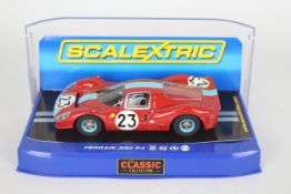Scalextric - A boxed Scalextric C3028 Ferrari 330 P4 RN23 1:32 scale slot car from the Scalextric