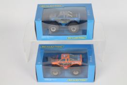 Scalextric - Two boxed Scalextric Monster Truck Formula 1 slot cars.