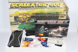 Scalextric - 2 x vintage boxed sets, # C559 Scalextric 200, # C634 Scalextric 400.