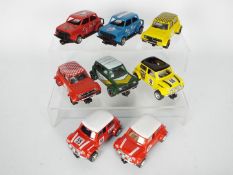 Scalextric - A collection of 8 x Mini models including three Mini Coopers and five Mini Clubman