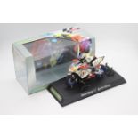 Scalextric - A boxed 2004 Moto GP Aprillia ridden by Shane Byrne # C6010 The model appears Mint in