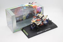 Scalextric - A boxed 2004 Moto GP Aprillia ridden by Shane Byrne # C6010 The model appears Mint in