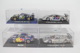 Scalextric - 4 x boxed cars, 2 x Mercedes Benz CLK LM, a Porsche 911 GT3R and a Porsche 911 GT1.