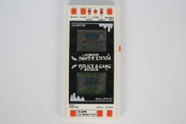 Bandai - A vintage 1984 Bandai Police & Gang LCD double play hand held game.