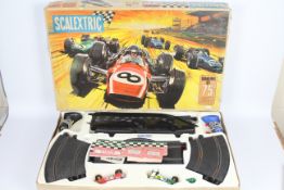 Scalextric - A vintage boxed Scalextric Grand Prix 75 set with a C/8 Lotus Indianapolis and a C/9