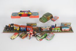 Wells Brimtoy, MTU,Other - A collection of vintage tinplate transport related toys.