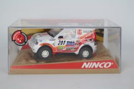Ninco - A boxed Mitsubishi Pajero Montero Rally car # 50306.