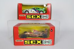 SCX - Matchbox - 2 x boxed models, a Toyota Celica # 83560.20 and a Jordan Peugeot F1 car # 83220.