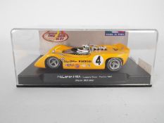 Thunderslot - A boxed McLaren M6A Can-Am car number 4 as driven by Bruce McLaren at the 1967 Laguna