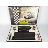 Scalextric - A vintage boxed French made set # 50 with # C72 BRM and # C73 Porsche racing cars.