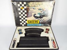 Scalextric - A vintage boxed French made set # 50 with # C72 BRM and # C73 Porsche racing cars.