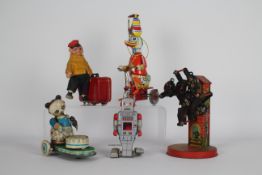 Schilling, Other - A small collection of unboxed collectable tinplate toys from various continents.