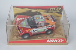 Ninco - A boxed Mitsubishi Pajero Evo Dakar # 50392.