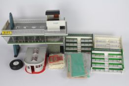 Herpa, Scalextric, Gilbert, Other - A collection of Scalextric and Herpa trackside buildings.