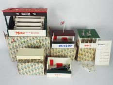 Scalextric - Four boxed vintage Scalextric trackside buildings / accessories.