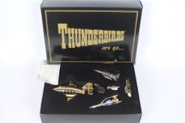 Matchbox Toys - A Gerry Anderson Thunderbirds gift set comprising of five gold coloured