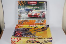 Carrera - 2 x boxed slot car racing sets,