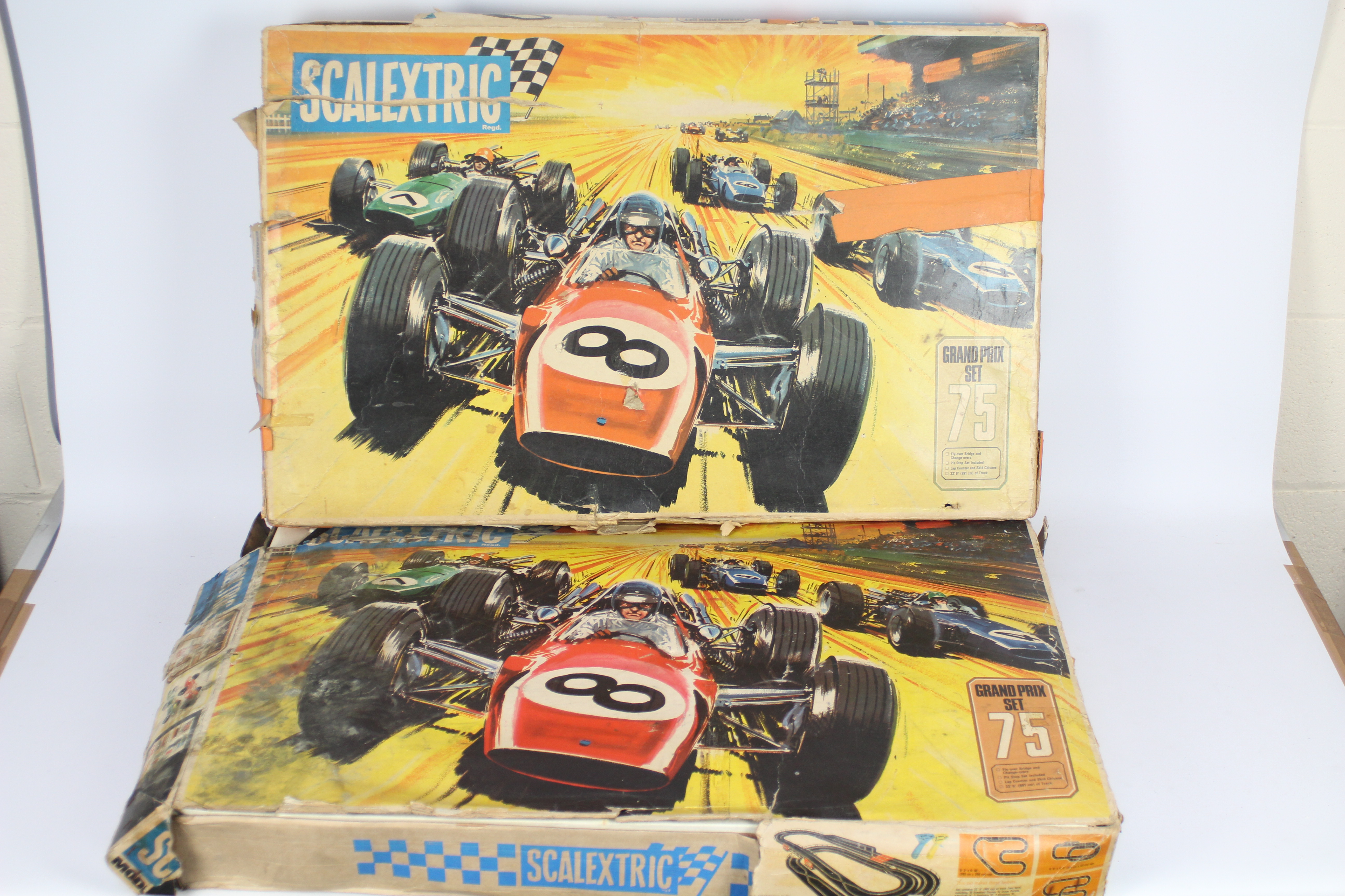 Scalextric - 2 x vintage boxed Grand Prix 75 sets in 1:32 scale.