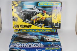 Scalextric - 2 boxed sets in 1:32 scale, # C1319 Continental Sports Cars, # C1097 Pole Position.